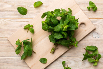 Fresh mint on Cutting board table, top view. Flat lay Space for text