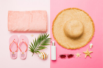 Top view travel or vacation concept. Composition with stylish beach accessories on colored...