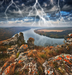 Peaceful view of the canyon Dnister river in a storm. Dramatic landscape with thunderstorm....