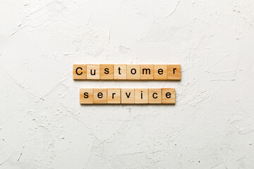 customer service word written on wood block. customer service text on cement table for your desing, concept