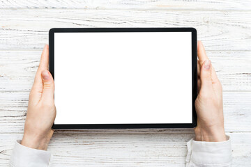 female teen hands using tablet pc with white screen, Mockup image of woman hand holding white tablet pc with blank white screen at home