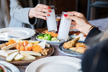 people clinking raki glasses, Cheers