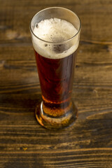 dark beer in a glass glass, fresh dark alcoholic beer