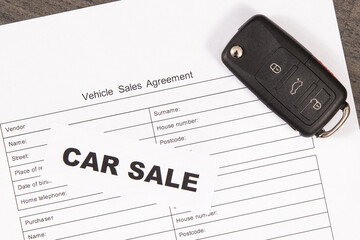 Car key, inscription car sale and form of vehicle sales agreement. Sales or purchases new or used...