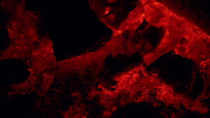 Night bonfire, logs are on fire. Bonfire burning brightly, heat. Close up.