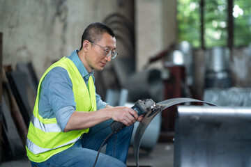 people using angle grinder in workshop