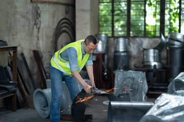 people using angle grinder in workshop