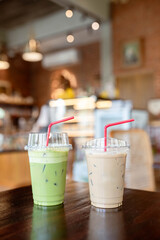 Green tea and coffee in plastic cups on tables, not in cafes.