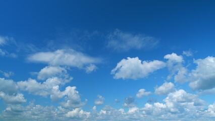 Soft white clouds. Clouds form against a dark blue sky. Blue sky white clouds. Time lapse.