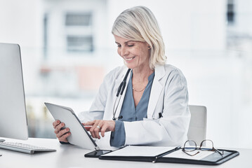 Happy, doctor and woman with tablet in office for patient data, medical trending news and...