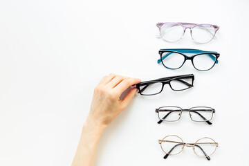 Eyeglasses top view. Comparing lenses in optics store