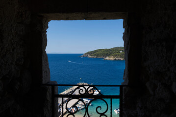 glimpse of the Tremiti islands from a window. Puglia, Italy.