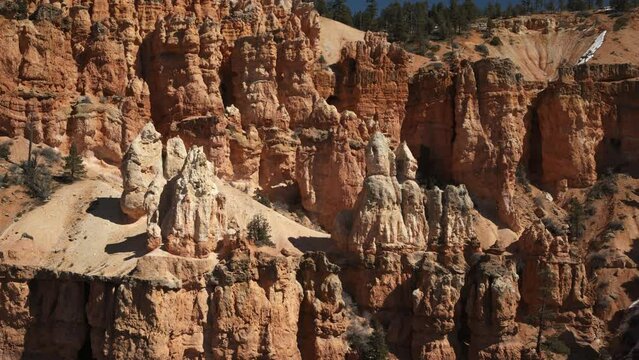 Aerial flyover view of hoodoo rock formations in Bryce Canyon / Utah, United States