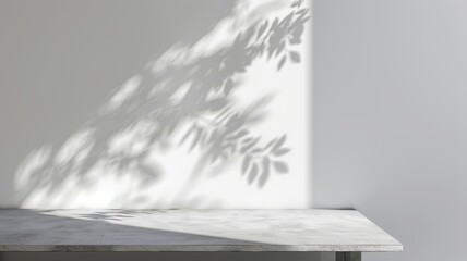 Minimalist Elegance. Shadows of Leaves Cast on a Grey and White Wall with a Simple Table.