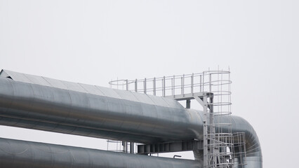 pipelines close-up against a gray sky
