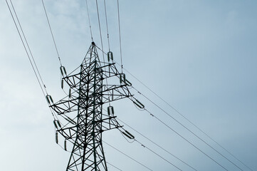 power transmission tower against the background of a gray sky