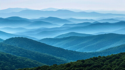 a panorama of fold mountains with layers of rolling hills fading into the horizon