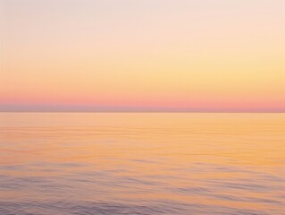 Obraz premium A sunrise over a calm ocean, with soft hues of orange and pink blending seamlessly, creating a serene background that evokes a sense of rhythm and peace