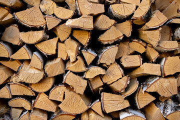 Birch firewood as a rustic background close-up