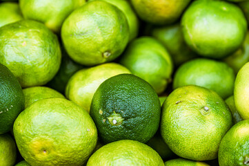 Fresh green limes on the market