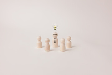 Group wooden people standing with light bulb icon idea, intelligent think power, creative and idea concept with white background