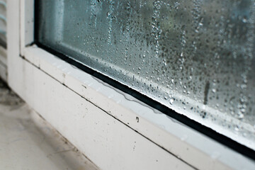 condensate. wet window glass due to high humidity