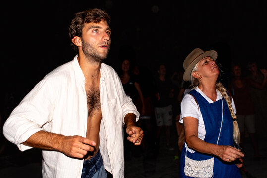 Mother and son dancing at outdoor concert