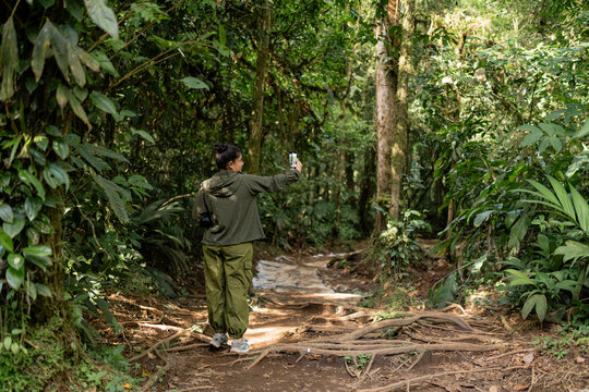 Tourist taking a selfie in the jungle