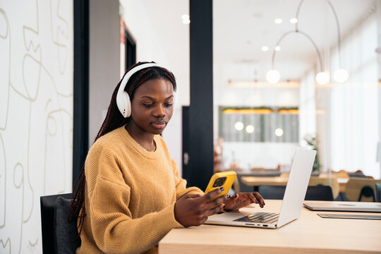 Young businesswoman using cellphone