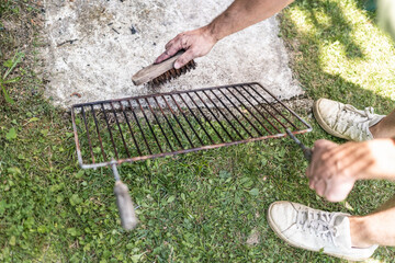 Cleaning the grill grate.