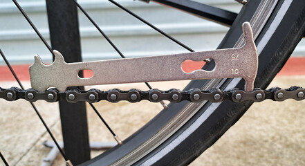 Photo of chain checker tool for worn bicycle chain