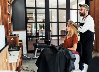 Hairdresser, man and woman client with hair care for consultation, makeover or grooming service. Boutique, luxury and male person with customer for hairstyle, beauty or wellness treatment in salon