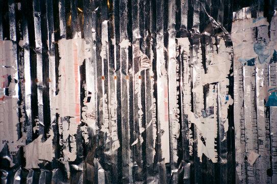 Traces of a torn paper notice on the wall