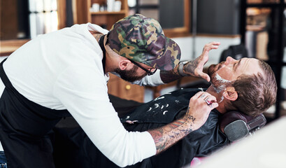 Beard, razor and barber with man for shave, haircut and grooming for hygiene, wellness or cosmetics. Barbershop, hairdresser parlor and person with shaving cream, foam and blade for hair service