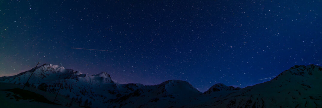 Night blue sky in spring evening with snow and star lights