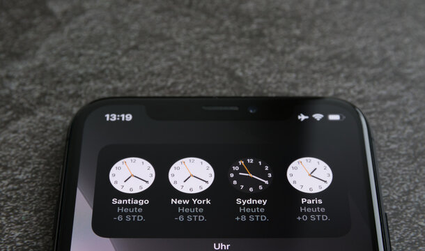 clocks from different countries on the phone