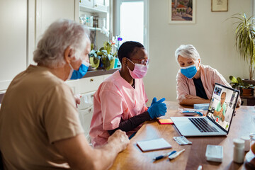 Senior couple having a telemedicine consultation with doctor during COVID-19 pandemic