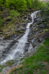 Waterfall in spring evening in valley of river Diveria in Gondo village