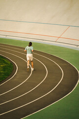 Runner on track Kyiv 2023 Ukraine morning shot