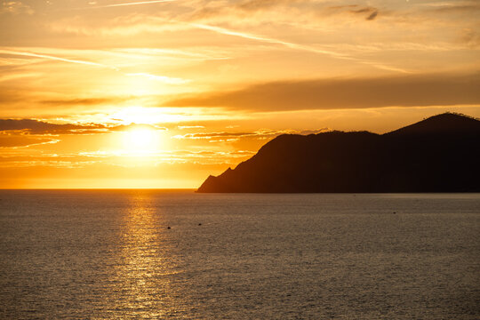 golden sunsent near riomaggiore in italy