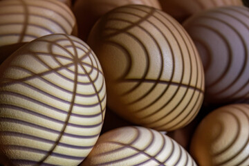 Patterns on eggs created with lights and shadows through an object.