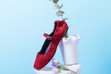 Red ballerina shoes on a rock