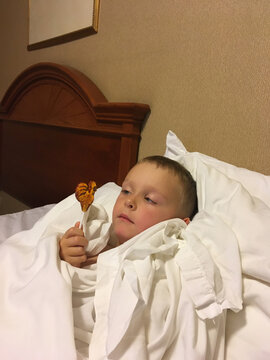 sick boy in bed
