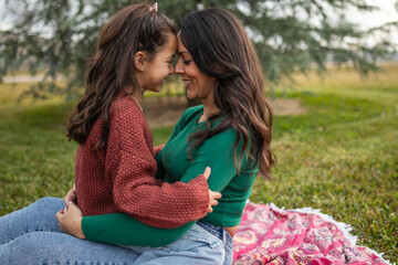 mother with little daughter on picnic