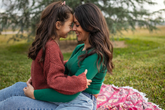 mother with little daughter on picnic