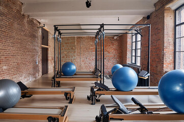 Urban pilates studio with red brick wall, doing excercises for the powerhouse, ai generated