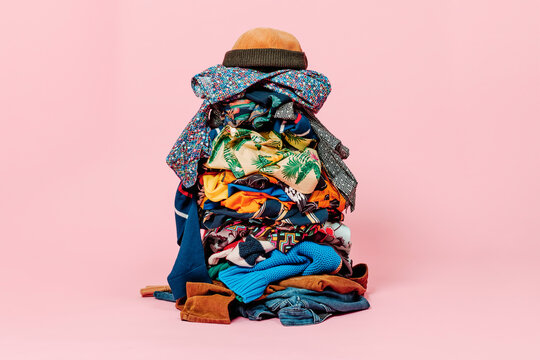 pile of clothes and cap