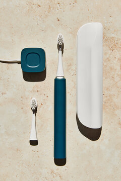 Blue electric toothbrush with accessories