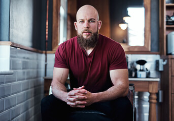 Barbershop and man for serious portrait in chair, small business and owner with vision for grooming...