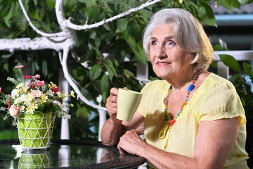 Portrait of a beautiful woman in the park in summer